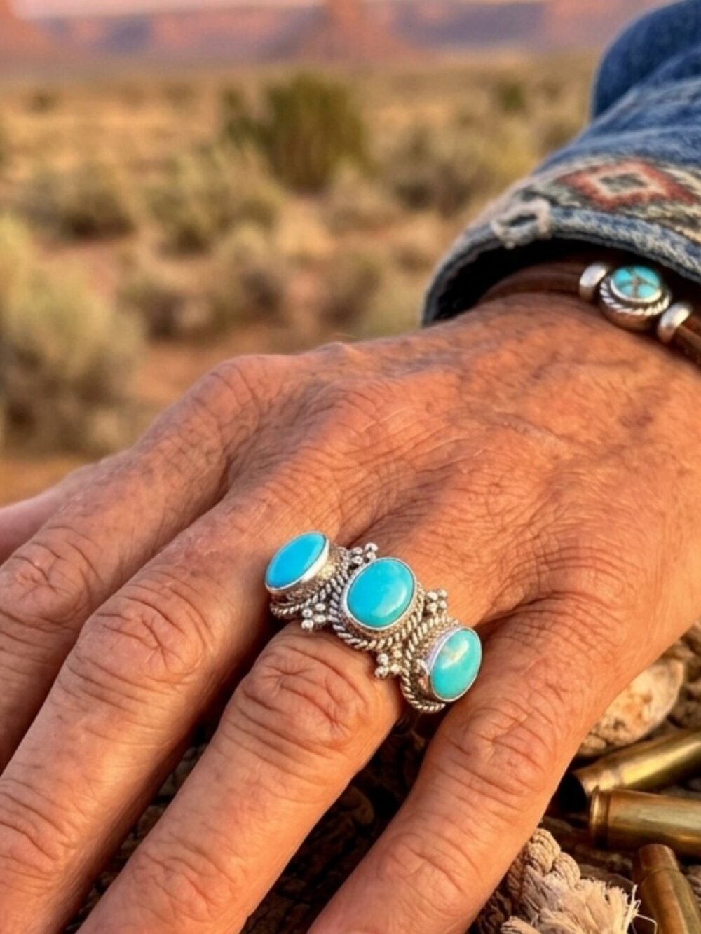 Southwestern-style ring features three Kingman turquoise stones set in .925